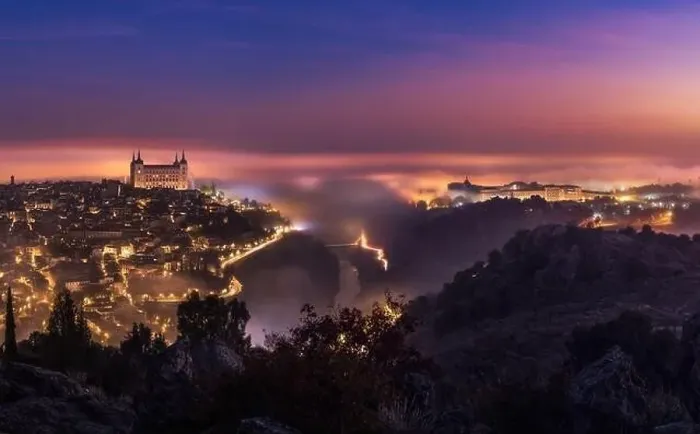 Framed Print : From above amazing scenery of illuminated ancient Alcazar de Toledo castle over town in misty twilight Framed Print : From above amazing scenery of illuminated ancient Alcazar de Toledo castle over town in misty twilight