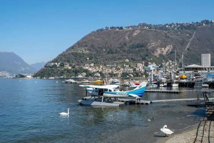 Framed Print : Amazing seaplane with swans in Como - Como lake in Italy Framed Print : Amazing seaplane with swans in Como - Como lake in Italy