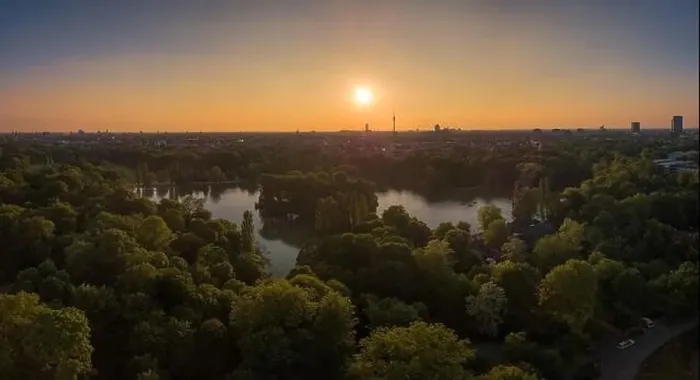 Framed Print : An amazing sunset over a lake, surrounded by trees in Munich, Bavaria Framed Print : An amazing sunset over a lake, surrounded by trees in Munich, Bavaria