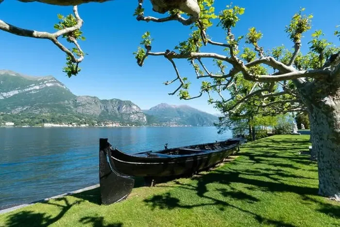 Framed Print : Amazing view of garden with boat in Bellagio - Como lake in Italy Framed Print : Amazing view of garden with boat in Bellagio - Como lake in Italy