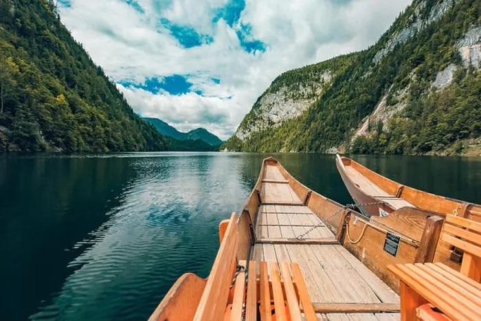 Framed Print : Amazing wooden boats on lake with reflection of mountain and sky. Freedom and adventure concept. Beautiful nature concept, mountain nature Framed Print : Amazing wooden boats on lake with reflection of mountain and sky. Freedom and adventure concept. Beautiful nature concept, mountain nature
