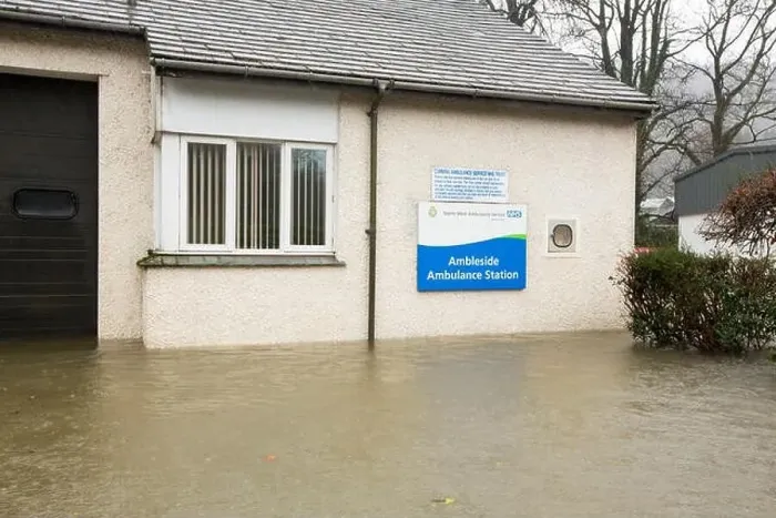 Framed Print : Ambleside Ambulance Station surrounded by flood waters by the banks of the River Rothay in Ambleside Framed Print : Ambleside Ambulance Station surrounded by flood waters by the banks of the River Rothay in Ambleside