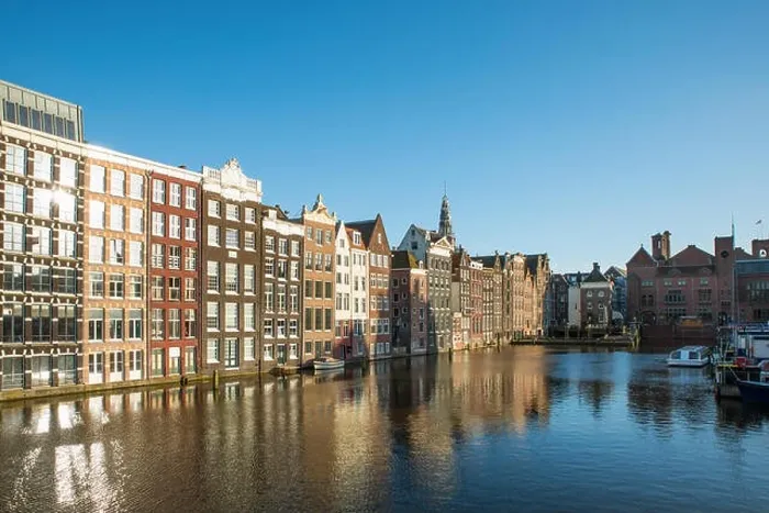 Framed Print : Amsterdam city view of Netherlands traditional houses with Amstel river in Amsterdam, Netherlands Framed Print : Amsterdam city view of Netherlands traditional houses with Amstel river in Amsterdam, Netherlands