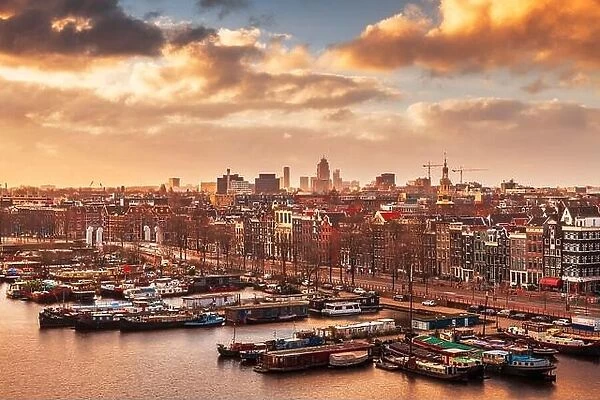 Amsterdam, Netherlands city skyline on the North Sea Canal at dusk