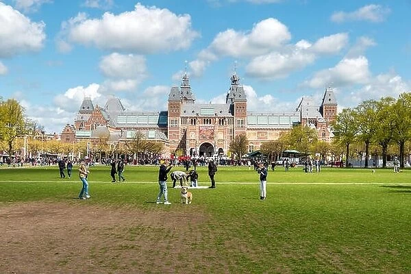 Amsterdam, Netherlands on May 03, 2016 : People chilling in the park on The Museumplein near Rijksmuseum museum area in Amsterdam, Netherlands