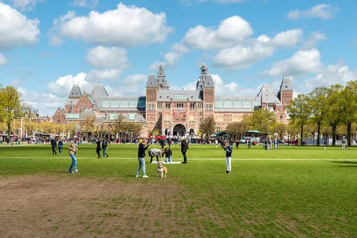 Framed Print : Amsterdam, Netherlands on May 03, 2016 : People chilling in the park on The Museumplein near Rijksmuseum museum area in Amsterdam, Netherlands