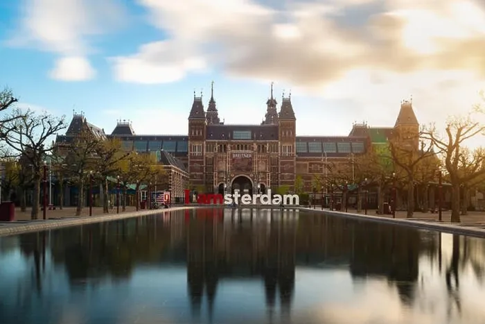 Framed Print : Amsterdam, Netherlands - May 3, 2016: Beautiful tulips in front of the Rijksmuseum (National state museum), a popular touristic destination in Amsterd Framed Print : Amsterdam, Netherlands - May 3, 2016: Beautiful tulips in front of the Rijksmuseum (National state museum), a popular touristic destination in Amsterd