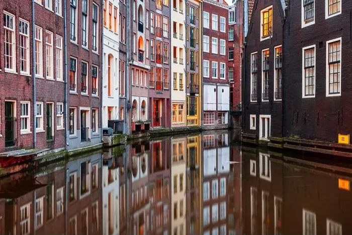 Framed Print : Amsterdam, Netherlands with narrow canals and buildings lining them in the morning time Framed Print : Amsterdam, Netherlands with narrow canals and buildings lining them in the morning time