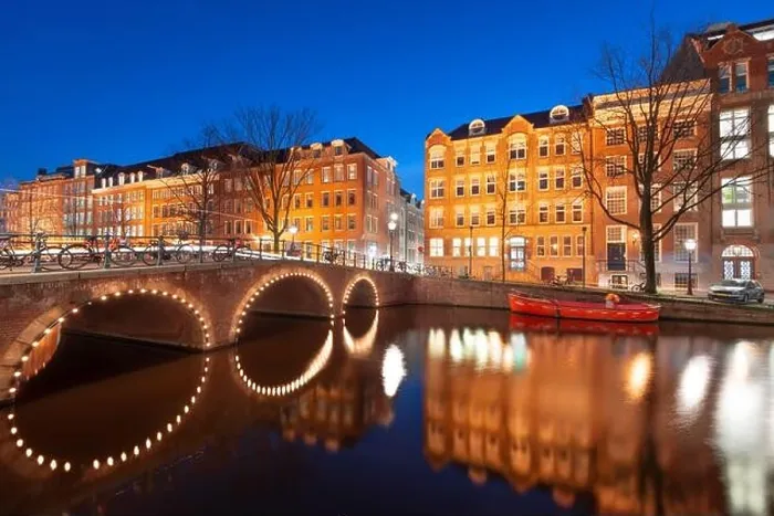 Framed Print : Amsterdam, Netherlands view of the cityscape on the canals at night Framed Print : Amsterdam, Netherlands view of the cityscape on the canals at night