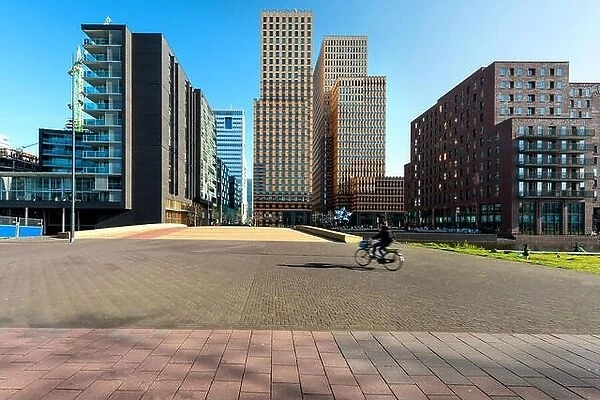 Amsterdam skyscraper, Netherlands. Office buildings in Amsterdam Zuid, Amsterdam, Netherlands. People bicycling in Amsterdam, Netherlands