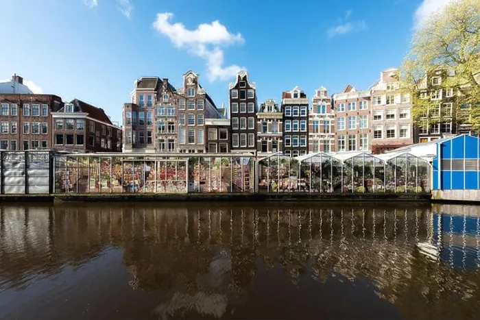 Framed Print : Amsterdam street traditional ancient dutch colorful buildings and flower market on Single canal in Amsterdam, Netherlands