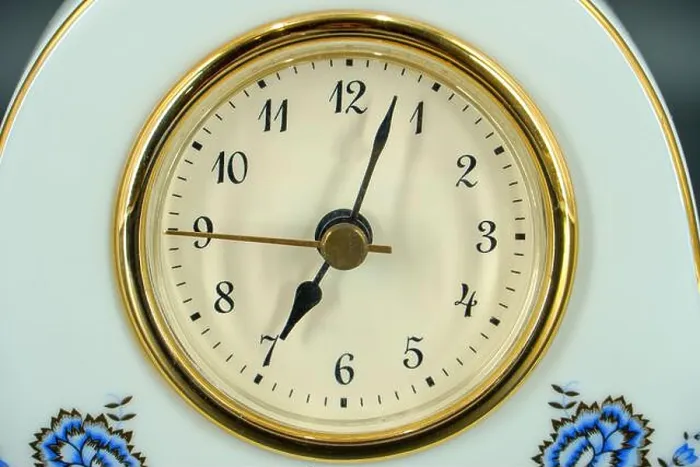 Framed Print : Analog alarm clock on table in bedroom. Time of day Framed Print : Analog alarm clock on table in bedroom. Time of day