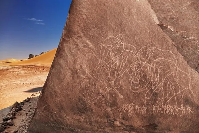 Framed Print : Ancient rock engraving in Sahara Desert, Tadrart, Algeria Framed Print : Ancient rock engraving in Sahara Desert, Tadrart, Algeria