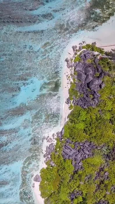 Framed Print : Anse Source Argent, La Digue. Downward aerial view of tropical coastline and granite rocks Framed Print : Anse Source Argent, La Digue. Downward aerial view of tropical coastline and granite rocks
