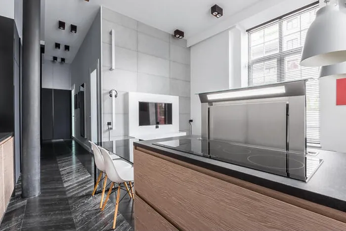 Framed Print : Apartment in industrial style and kitchen worktop with induction hob