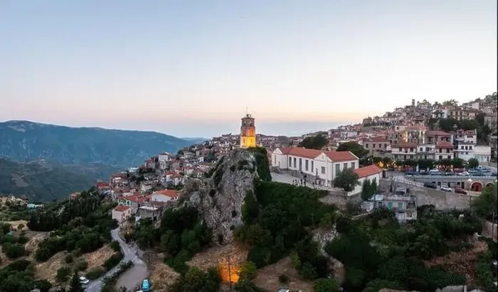 Framed Print : Arachova Greece mountain town aerial drone view. Traditional houses and illuminated stone tower clock, in the evening Framed Print : Arachova Greece mountain town aerial drone view. Traditional houses and illuminated stone tower clock, in the evening
