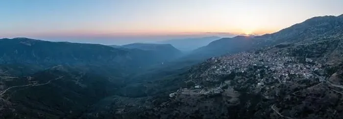 Framed Print : Arachova Greece mountain town aerial panoramic view. Traditional houses and stone tower clock at sunset Framed Print : Arachova Greece mountain town aerial panoramic view. Traditional houses and stone tower clock at sunset