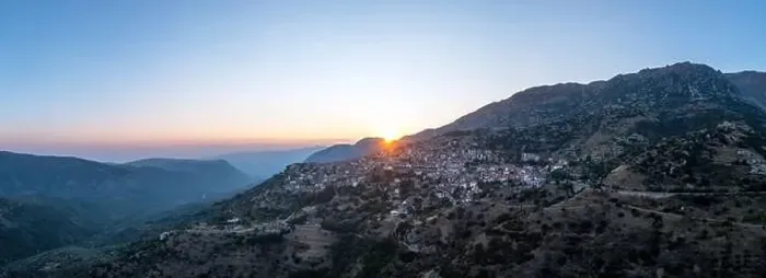 Framed Print : Arachova Greece mountain town aerial panoramic view. Traditional houses and stone tower clock at sunset Framed Print : Arachova Greece mountain town aerial panoramic view. Traditional houses and stone tower clock at sunset