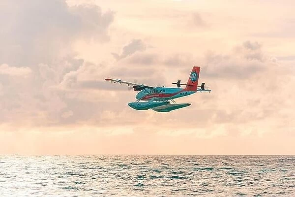 Ari Atoll, Maldives - 05.10.2019: Seaplane at tropical beach resort. Luxury summer travel destination seaplane in Maldives islands. Exotic vacation