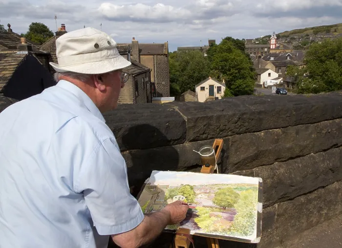 Framed Print : Artist Dez Wilson painting his local town of Marsden in the Colne Valley, West Yorkshire, UK Framed Print : Artist Dez Wilson painting his local town of Marsden in the Colne Valley, West Yorkshire, UK