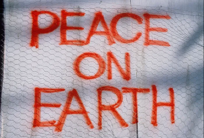 Framed Print : Artwork. Graffiti message painted on wall. 'Peace on Earth' Framed Print : Artwork. Graffiti message painted on wall. 'Peace on Earth'