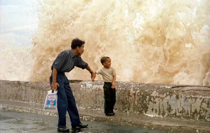 Framed Print : ASB79438 Indian father and son enjoying huge sea waves in Bombay monsoon in India Framed Print : ASB79438 Indian father and son enjoying huge sea waves in Bombay monsoon in India