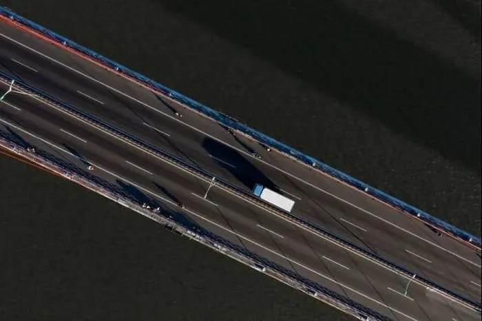 Framed Print : Top ascending aerial view of cable- stayed Can Tho bridge road with driving cars Framed Print : Top ascending aerial view of cable- stayed Can Tho bridge road with driving cars