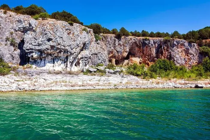 Framed Print : An ascetic building nestled into the rocky cliffs along the shore of Megali Prespa Lake Framed Print : An ascetic building nestled into the rocky cliffs along the shore of Megali Prespa Lake