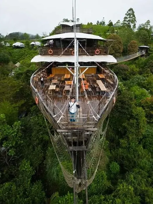 Framed Print : Asian Tourist Posing on Deck of Large Wooden Ship Restaurant in Lembang Forest Framed Print : Asian Tourist Posing on Deck of Large Wooden Ship Restaurant in Lembang Forest