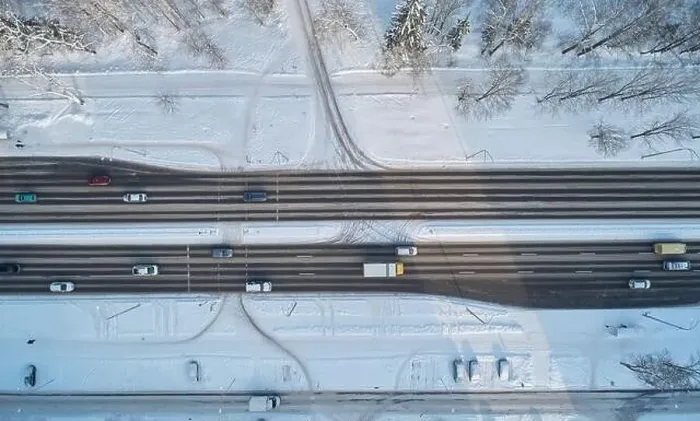 Framed Print : Asphalt frozen road aerial drone top view. Highway road Framed Print : Asphalt frozen road aerial drone top view. Highway road