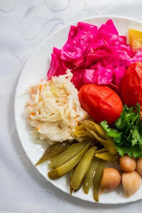 Framed Print : assorted pickled vegetables with cabbage and tomatoes with cucumbers on a plate Framed Print : assorted pickled vegetables with cabbage and tomatoes with cucumbers on a plate