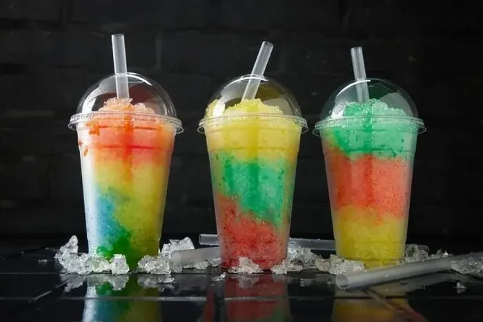 Framed Print : Assortment of various slush drinks in a row on black and dark background Framed Print : Assortment of various slush drinks in a row on black and dark background