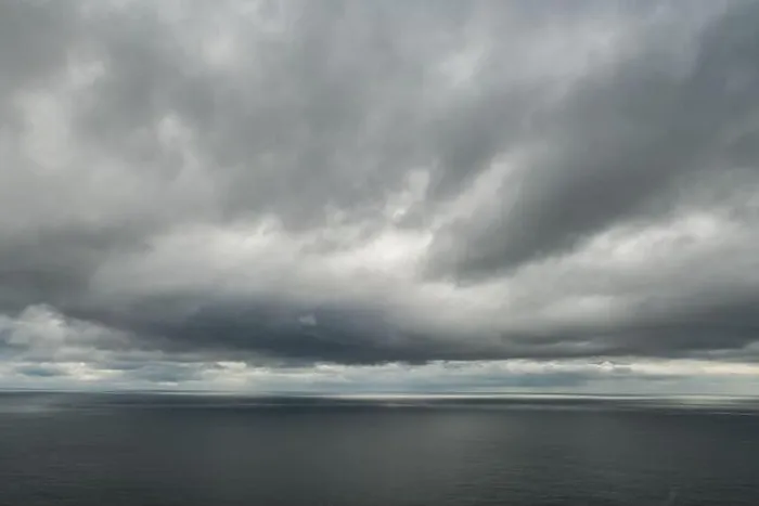 Framed Print : Atlantic ocean water and dramatic cloudy sky background. Sea water texture closeup. Landscape photography