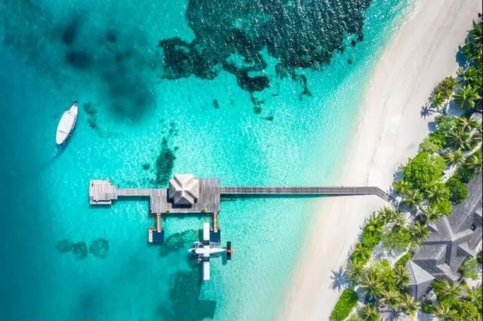 Framed Print : Atolls and islands in Maldives with jetty and over water villas. Luxury summer holiday vacation, white sand, blue sea, idyllic tropical island beach