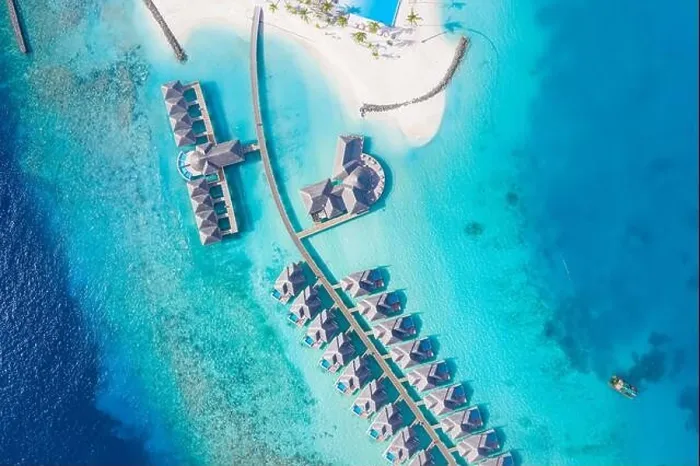Framed Print : Atolls and islands in Maldives. Tropical island at Maldives with luxury water villas, bungalows over amazing blue sea. Summer vacation, aerial view Framed Print : Atolls and islands in Maldives. Tropical island at Maldives with luxury water villas, bungalows over amazing blue sea. Summer vacation, aerial view