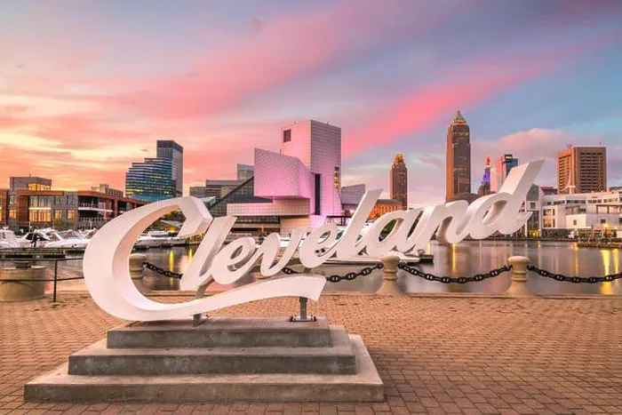 Framed Print : AUGUS1 10, 2019 - CLEVELAND, OHIO: The landmark skyline of downtown Cleveland from Voinovich Bicentennial Park in the early morning Framed Print : AUGUS1 10, 2019 - CLEVELAND, OHIO: The landmark skyline of downtown Cleveland from Voinovich Bicentennial Park in the early morning
