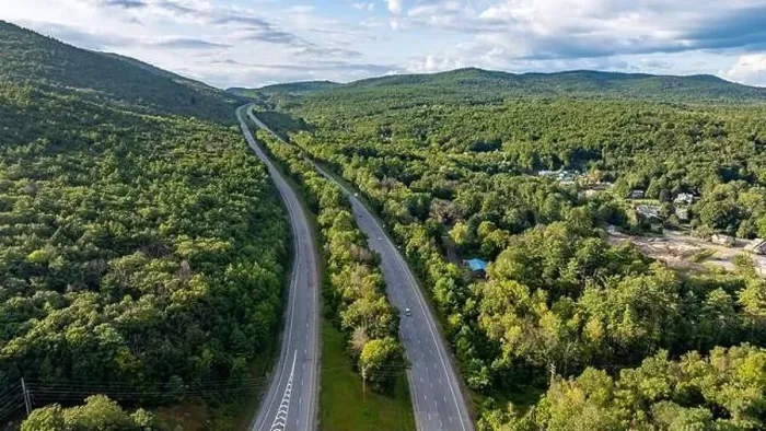 Framed Print : August 20 2024, Sunny afternoon summer aerial image of the interstate, I 87 north of Lake George, NY, USA Framed Print : August 20 2024, Sunny afternoon summer aerial image of the interstate, I 87 north of Lake George, NY, USA