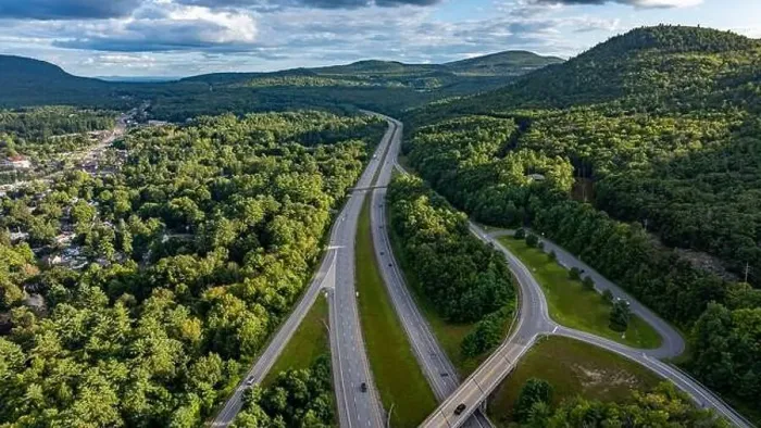 Framed Print : August 20 2024, Sunny afternoon summer aerial image of the interstate, I 87 north of Lake George, NY, USA Framed Print : August 20 2024, Sunny afternoon summer aerial image of the interstate, I 87 north of Lake George, NY, USA