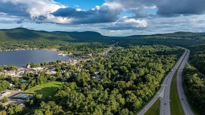 Framed Print : August 20 2024, Sunny afternoon summer aerial image of the interstate, I 87 north of Lake George, NY, USA Framed Print : August 20 2024, Sunny afternoon summer aerial image of the interstate, I 87 north of Lake George, NY, USA