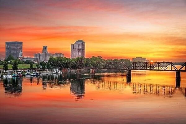 Augusta, Georgia, USA downtown skyline on the Savannah River at sunset