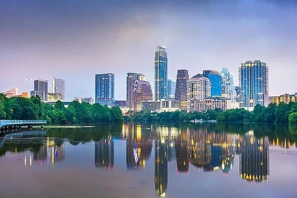 Austin, Texas, USA downtown skyline on the Colorado River at night