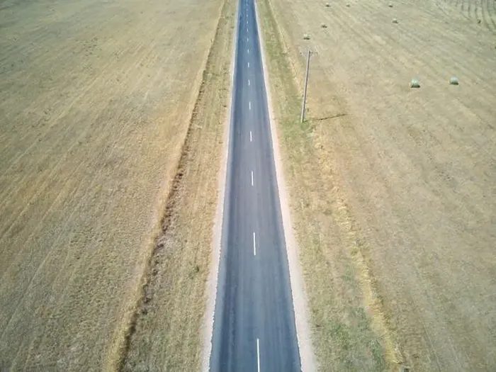 Framed Print : Australia highway aerial view showing rural highway, farmland and round hay bales, Victoria, Australia Framed Print : Australia highway aerial view showing rural highway, farmland and round hay bales, Victoria, Australia