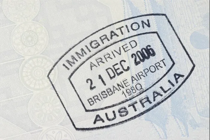 Framed Print : Australia immigration entry stamp on the inside page of a passport. Space for copy Framed Print : Australia immigration entry stamp on the inside page of a passport. Space for copy