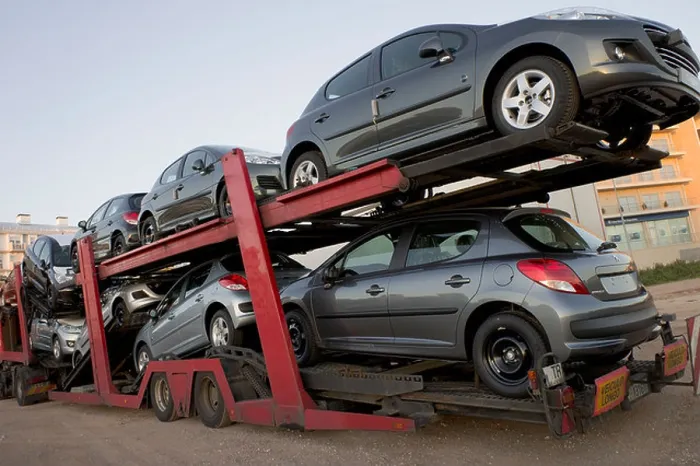 Framed Print : Automobile transport truck carrying new cars to be delivered Framed Print : Automobile transport truck carrying new cars to be delivered