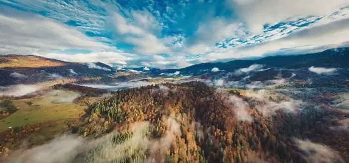 Framed Print : Autumn flight through blue sky in Carpatian autumn mountains, Aerial panoramic drone shot Framed Print : Autumn flight through blue sky in Carpatian autumn mountains, Aerial panoramic drone shot