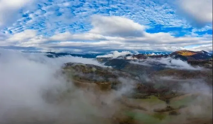 Framed Print : Autumn flight through blue sky in Carpatian autumn mountains, Aerial panoramic drone shot Framed Print : Autumn flight through blue sky in Carpatian autumn mountains, Aerial panoramic drone shot