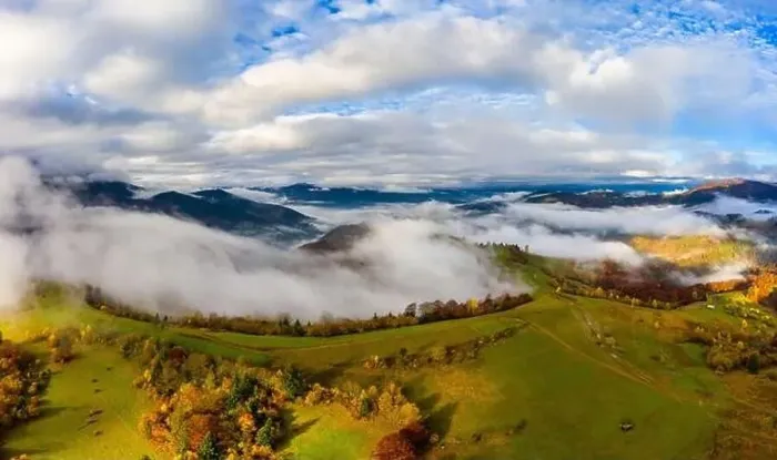 Framed Print : Autumn flight through blue sky in Carpatian autumn mountains, Aerial panoramic drone shot Framed Print : Autumn flight through blue sky in Carpatian autumn mountains, Aerial panoramic drone shot