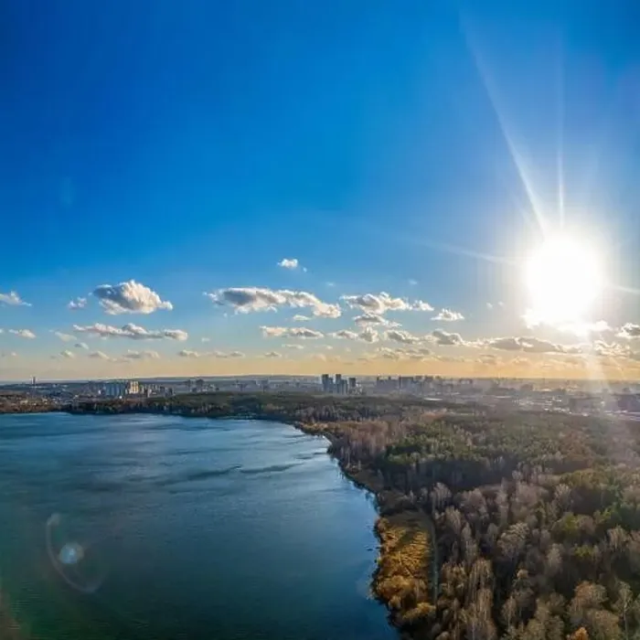 Framed Print : Autumn forest on lake shore at sunset and city on horizon, auerial view. Lake Shartash and Yekaterinburg, Russia Framed Print : Autumn forest on lake shore at sunset and city on horizon, auerial view. Lake Shartash and Yekaterinburg, Russia