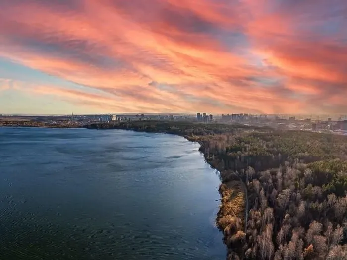 Framed Print : Autumn forest on lake shore at sunset and city on horizon, auerial view. Lake Shartash and Yekaterinburg, Russia Framed Print : Autumn forest on lake shore at sunset and city on horizon, auerial view. Lake Shartash and Yekaterinburg, Russia