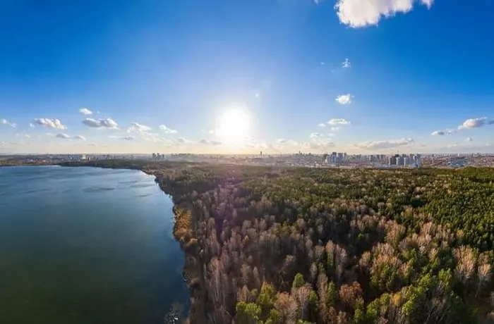 Framed Print : Autumn forest on lake shore at sunset and city on horizon, auerial view. Lake Shartash and Yekaterinburg, Russia Framed Print : Autumn forest on lake shore at sunset and city on horizon, auerial view. Lake Shartash and Yekaterinburg, Russia